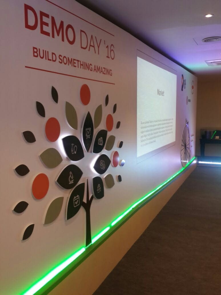 Demo Day stage and brand wall setup
